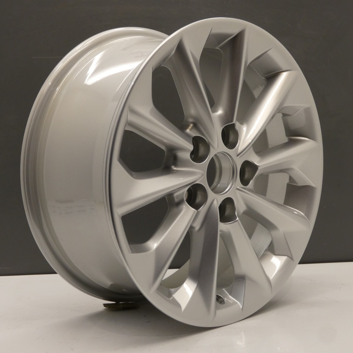「１/２」TOYOTA COROLLA WXB R17 5x100 純正ホイール s-l1200.jpg