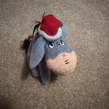 Vintage Disney Winnie the Pooh Eeyore plush Ornament wearing festive Santa hat