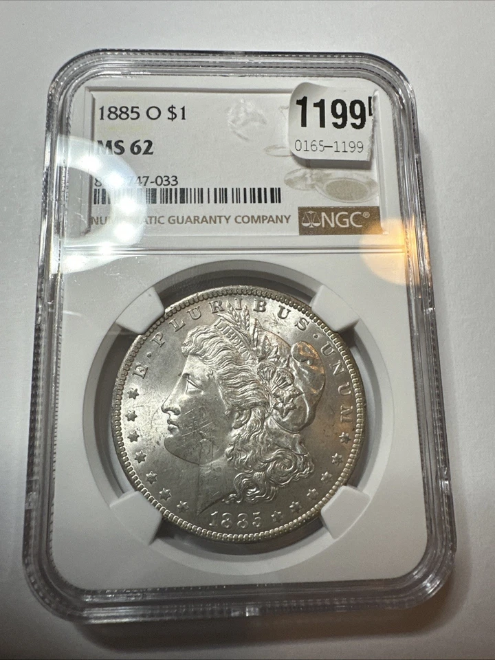 Dólar de plata Morgan 1885-O $1 - NGC MS62 - tóner arco iris de Nueva Orleans 🌈 Foto 2 de 2