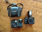 Two Minolta film cameras Hi-Matic Fp and Hi-Matic S and Electroflash Cp