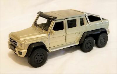 Welly - 1:34 -1:39 Scale Model Mercedes-Benz G 63 AMG 6x6 Gold