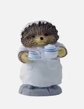 Enesco porcelain figurine... Beatrix Potter/ Mrs. Tiggy-winkle pouring tea