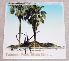 DWIGHT YOAKAM SIGNED 'SWIMMIN' POOLS, MOVIE STARS...' VINYL ALBUM RECORD W/COA