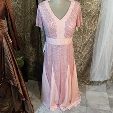 Shine in this elegant pink sequin dress perfect for any special occasion.size 10