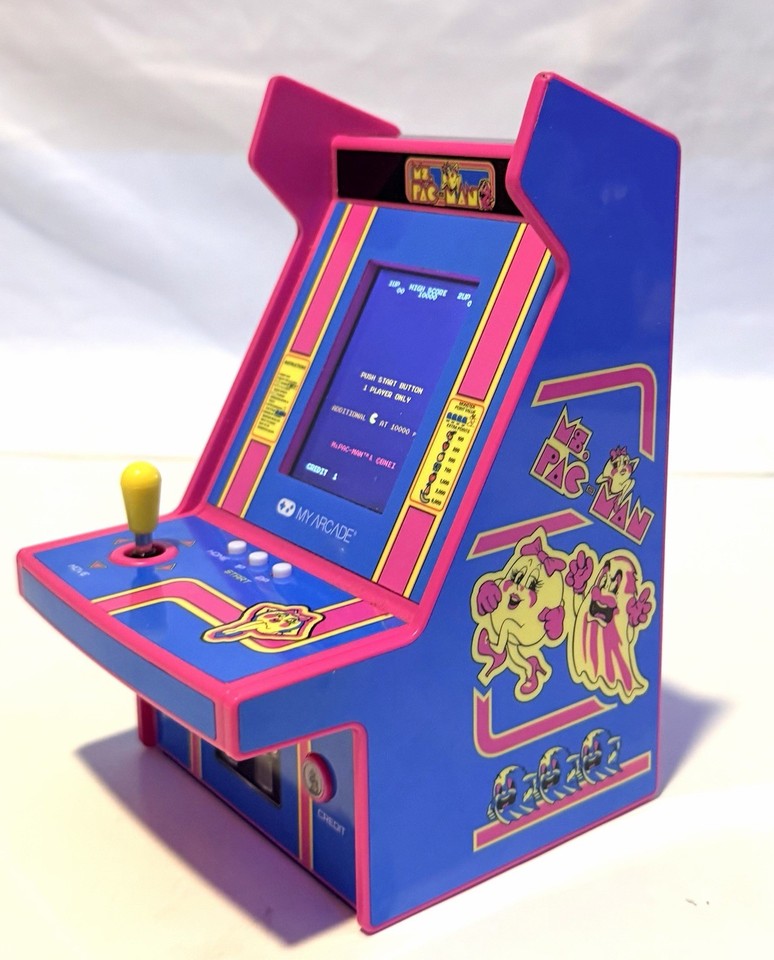A palm-sized fully playable Ms. Pac-Man arcade cabinet — a desk toy that's also a real game, delivering genuine retro arcade nostalgia in miniature form.