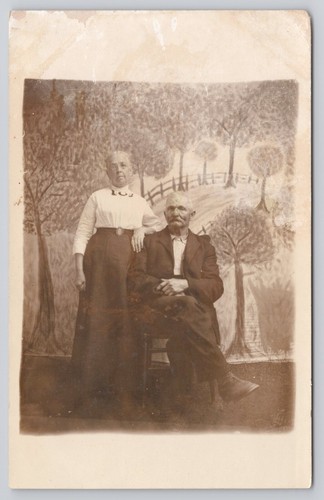 RPPC Elderly Couple Man Woman Trees Backdrop Real Photo c1904-1918 Postcard