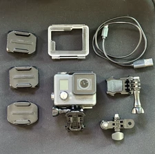 GoPro Hero Plus; adhesive mounts and extra bases included.