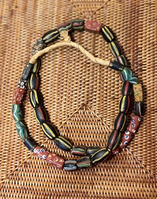 39Venetian Trade Beads 20+striped yellow, rust & green on black; also millefiori