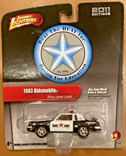 New 2011 Johnny Lightning 1983 Oldsmobile Cutlass Police Beat The Heat