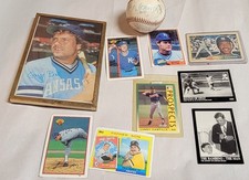 lot of 9 baseball cards and on signed base ball Chipper, George Brett