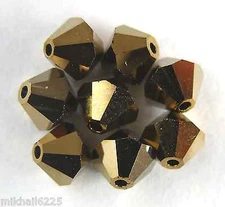 5 5mm Swarovski 5301 Crystal Bicones -- Dorado 2x(Please Read Item Description)