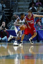Kevin Ollie Milwaukee Bucks drives around Marko Jaric at the pres- 2002 Photo