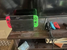 gently used nintendo switch console + 4 controllers + 4 games 