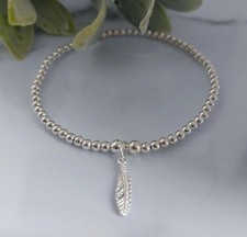 Sterling Silver Bead Elasticated Stretch Bracelet With Feather Charm