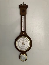 VINTAGE AIRGUIDE BANJO STYLE 9V RAIDO WEATHER CENTER. 24.5”H. MODEL # 299