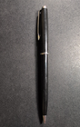 Black Eversharp mechanical pencil with silver tone trim, made in USA, on textured black surface.