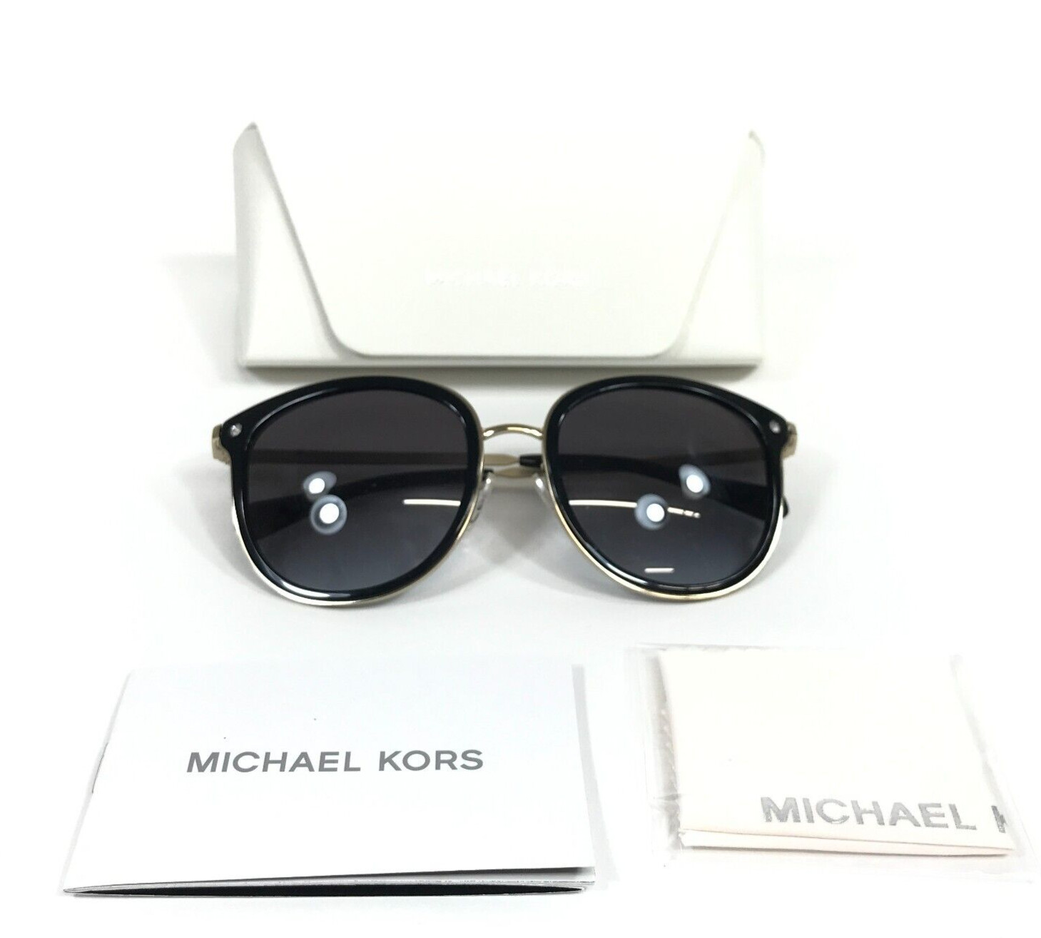 Солнцезащитные очки Michael Kors MK1099B Adrianna Bright 30058G в золотой оправе с серыми линзами 10990₽