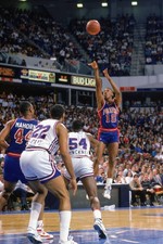 Dennis Rodman Detroit Pistons shoots a jump shot over Ed Pinckney - Old Photo