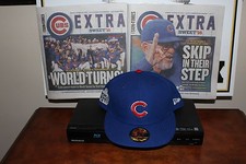 CHICAGO CUBS 2016 WORLD SERIES BLUE HAT 59 7 3/8 XL T SHIRT AND 2 CUBS PAPERS.