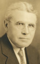 SILVER HAIRED MAN WITH WIRE RIMMED GLASSES. 8 X 10 TONED SILVER PRINT.