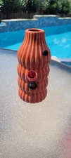 Orange Ribbed Vase Repurposed Into a Bong