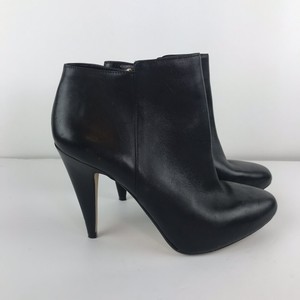 black ankle boots with gold zipper