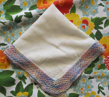 Vintage pastel colors crochet on white linen handkerchief, hanky