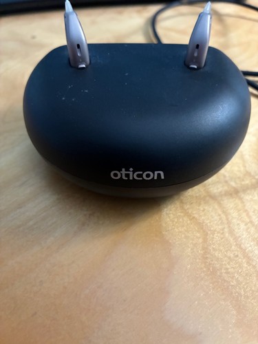 Oticon OPN S3 hearing aids rechargeable pair behind the ear.