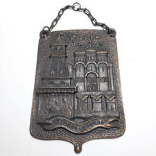 A rare, antique Soviet-era copper wall plaque, engraved with the Kremlin emblem