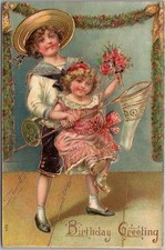 1910s HAPPY BIRTHDAY Embossed Postcard Boy  Girl / Butterfly Net  Roses UNUSED