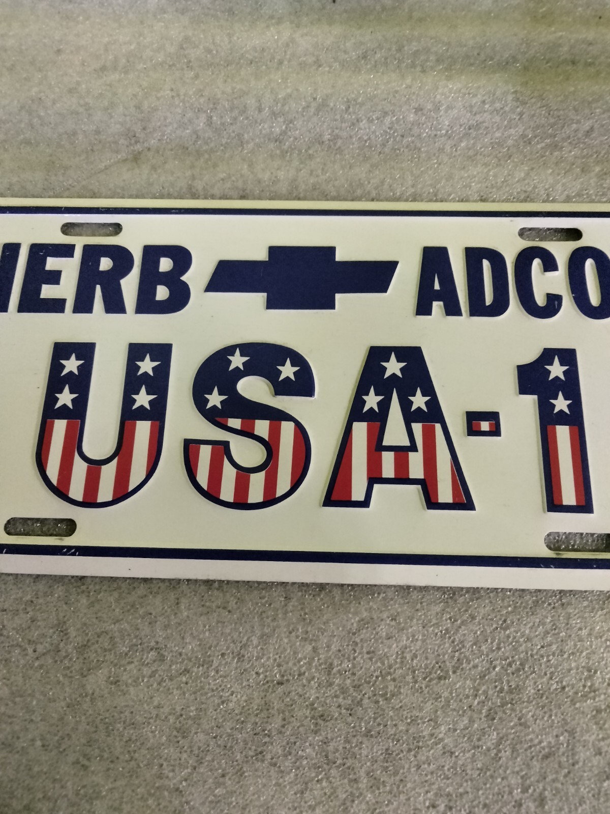 Herb Adcox USA1 Chevrolet Dealership Booster License Plate Chattanooga