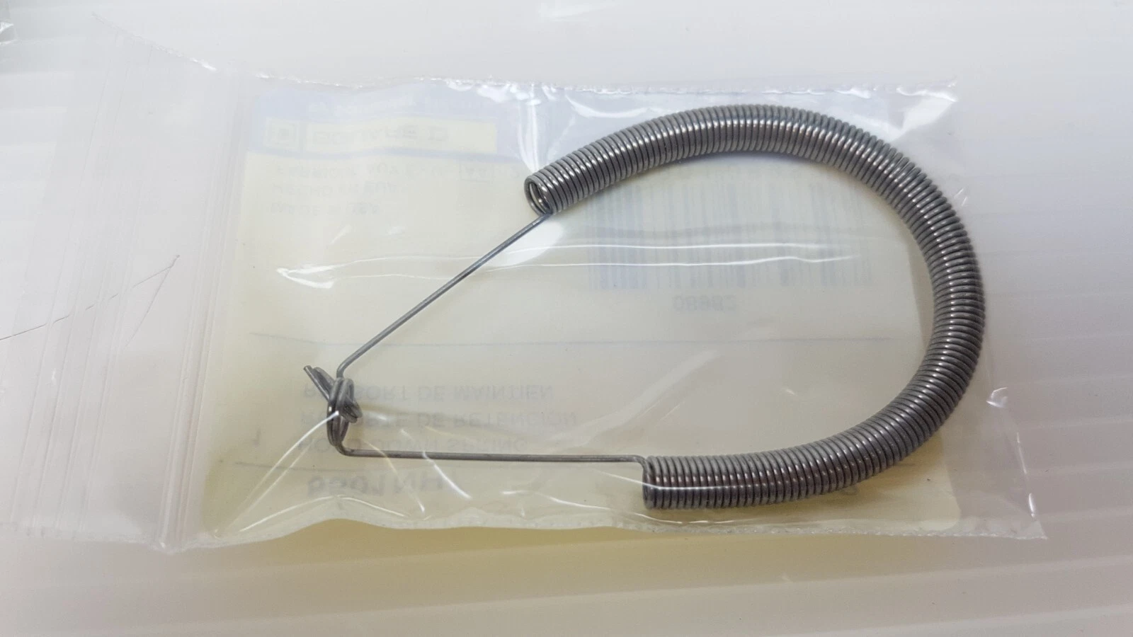 One Square D 8501NH7 relay hold-down spring clip in its bag