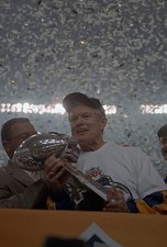 Head Coach Dick Vermeil of St Louis Rams hold up the Vince Lombard- Old Photo
