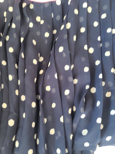 Skirt features a fun polka dot pattern and a ruffle accent - Picture 2 of 4