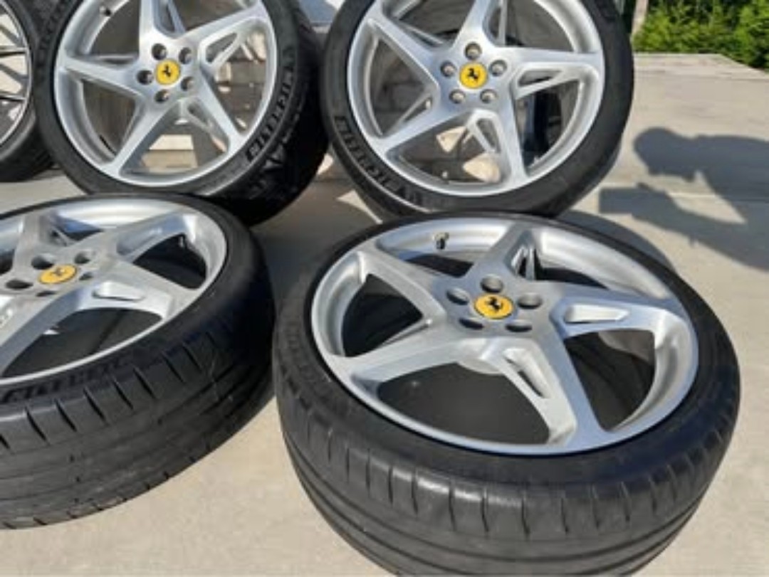 Here is a full set of ferrari original Wheels off of a 458 italia. 