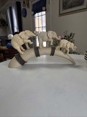 Three Elephants Marching  On A Faux Tusk