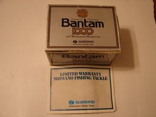 Vintage NOS Shimano Bantam 1000 baitcasting reel in box,with tools & oil
