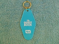 RARE COLLECTIBLE THE GUEST BOOK TBS HOTEL Keychain Car Accessory NEW IN PACKAGE