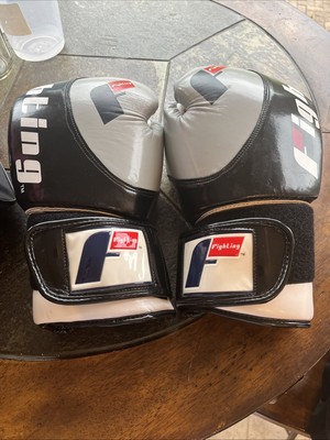 Fighting Boxing Gloves In Title Boxing Pink Duffle Bag Comes With Wrist Wraps.