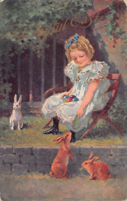 1914 Easter Postcard of Little Girl Feeding Bunny Rabbits - Colored Eggs on Lap