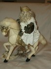 Old World Saint Nick Riding on a Wooden Horse Holding a Bird in a Cage  — photo 1