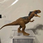 Jurassic World Brown Dinosaur Action Figure Blue Markings Sound Holes JP Logo — photo 1