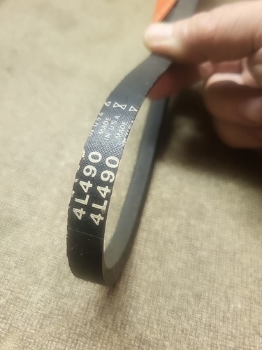 Black Western Auto 46-1949-0 V-belt with white printed specifications and orange side panel, made in USA.