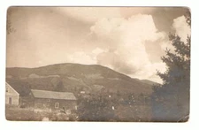 Undated Unused Postcard Real Photo RPPC Mountains with House and Great Clouds
