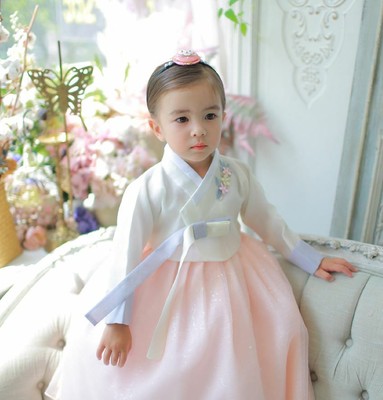 white and pink baby dress