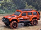 2026 Hot Wheels SAFARI MODE Design '95 JEEP CHEROKEE 4x4?Orange;mud?  LOOSE