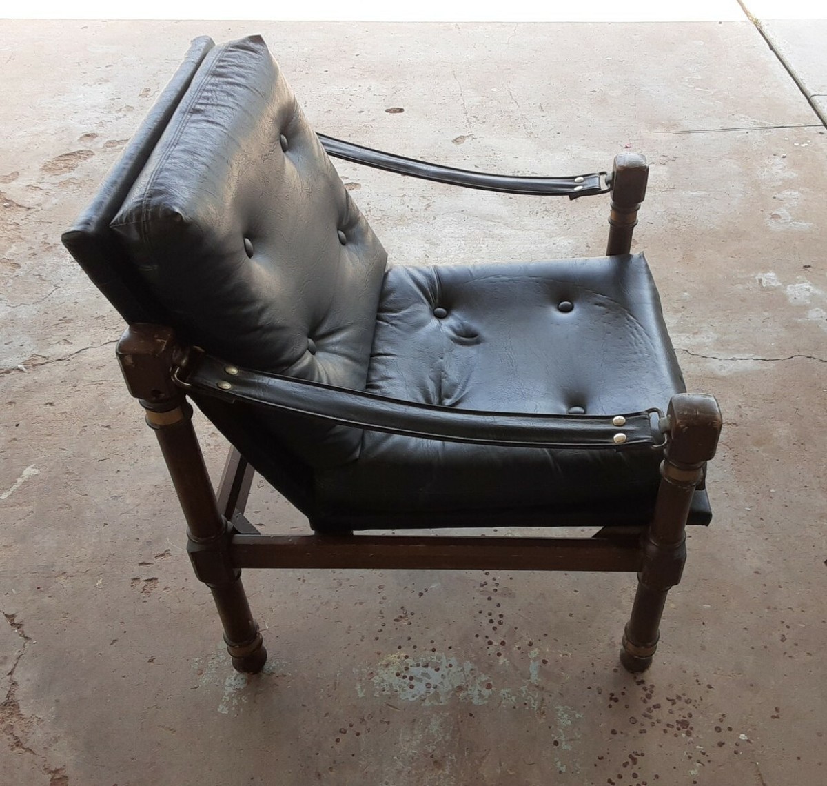 modern black leather sling-back chair safari campaign Wood Brass