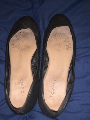 well worn ballet flats