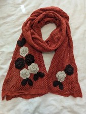 Orange crochet scarf with black cream flower appliques