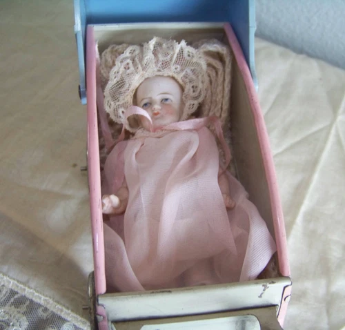 ANTIQUE ALL BISQUE GERMAN DOLL  &  OHIO ART  TIN BABY BUGGY with  LITHOGRAPHY